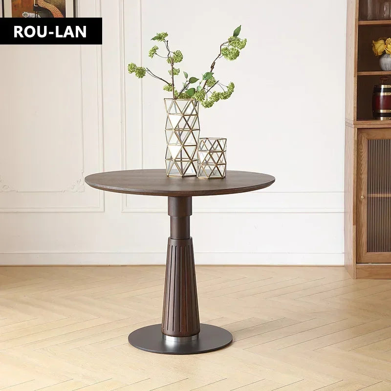 Astoria Collection | Round Walnut & Brass Dining Table - framed in an editorial still-life composition in a Mid-Century Modern dining room setting.
