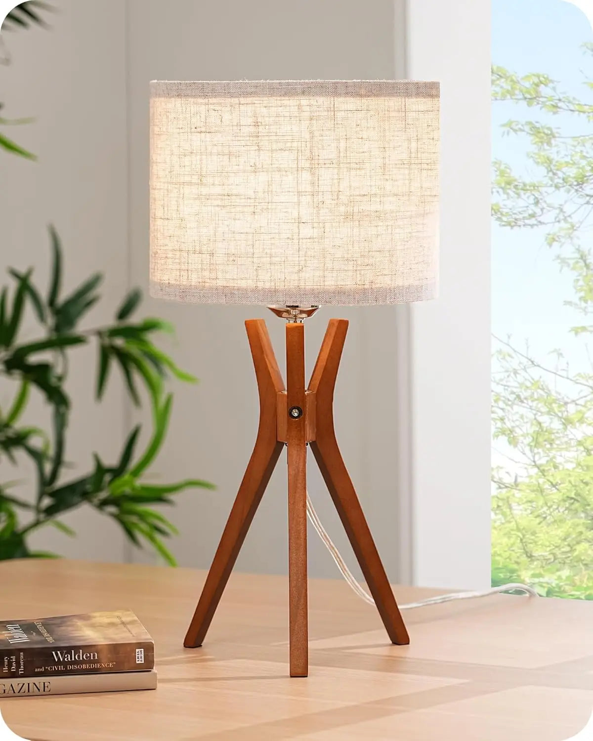 Astoria Collection | Sculptural Brass-Accented Walnut Tripod Lamp - captured in a curated lifestyle vignette in a Mid-Century Modern living room setting.