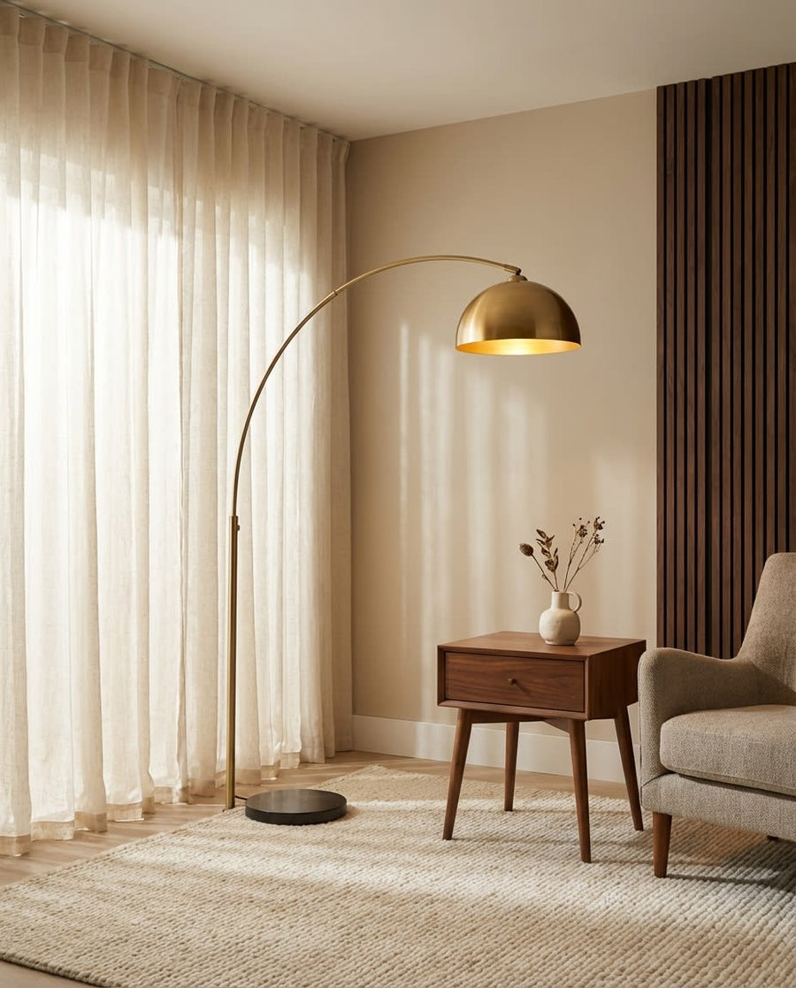 Belmont Collection | Sculptural Marble-Topped Brushed Brass Arc Lamp - showcasing full sculptural form and material finish in a Mid-Century Modern living room setting.